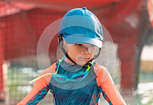 Portrait of a Little boy playing in swimming training pool