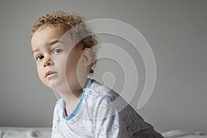 Portrait of little boy in pyjamas before going to sleep