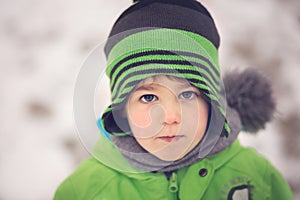 Portrait of a little boy in winter