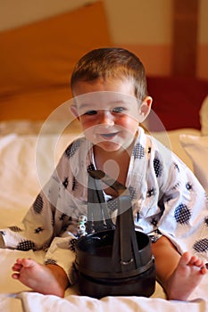 Portrait of a little cheerful baby wearing a traditional yukata in a ryokan`s room in Takayama city