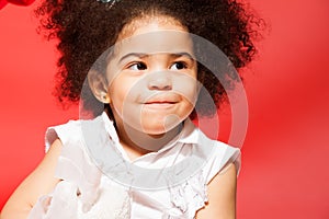 Portrait of little cunning curly haired girl