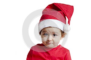 Portrait little cute girl at christmas in santa claus hat and red holiday clothes