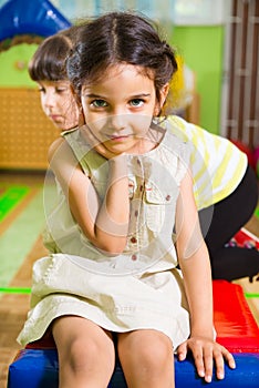 Portrait of little cute latin girl in daycare