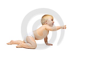 Portrait of little cute toddler boy, baby in diaper crawling isolated over white studio background