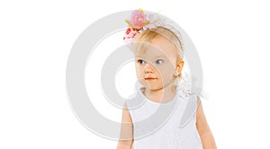 Portrait little girl child with floral wreath headband on her head on a white background