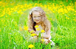 Portrait of little girl child outdoors on the grass