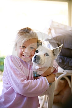 Portrait, little girl and dog with hug in home for bonding, playing and happy together. Friends, child or puppy for