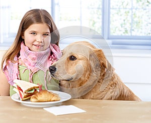 Portrait of little girl and dog smiling