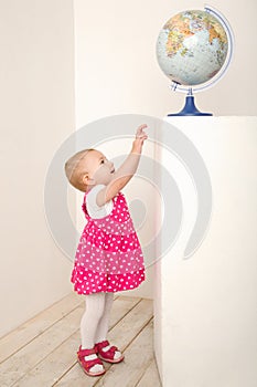 Portrait of little girl with globe