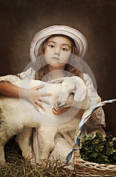 Portrait of a little girl with her pet goat