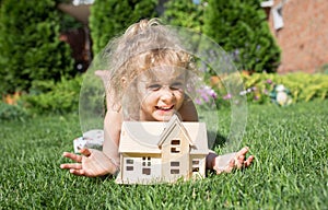 Portrait of little girl lying on grass