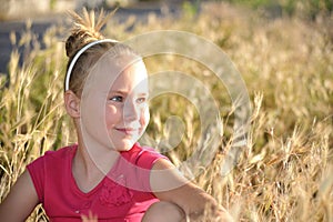 Portrait of little girl in nature.Side view