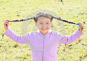 Portrait little girl with plaits photo
