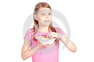 Portrait of a little girl with popcorn on white