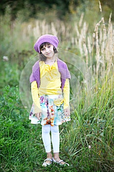 Portrait of little girl posing outdoors