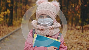 Portrait of little girl in protective mask