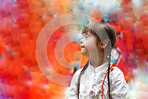 Portrait of little girl smiling on background of the colorful wall