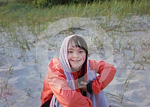 Portrait of little girl smiling outside