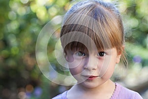 Portrait of little girl with surprised expression on face