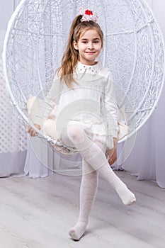 Portrait of a little girl on swing photo