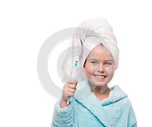 portrait of little girl wearing bathrobe with towel on head with