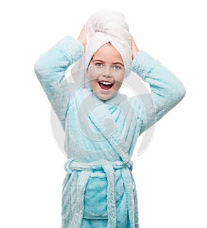 portrait of little girl wearing bathrobe with towel on head