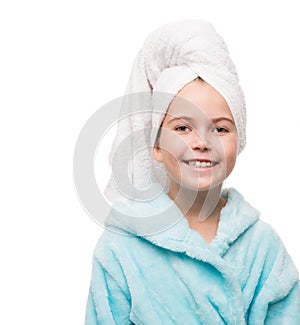 portrait of little girl wearing bathrobe with towel on head