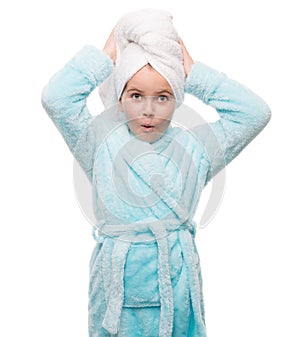 portrait of little girl wearing bathrobe with towel on head