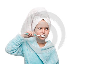 portrait of little girl wearing bathrobe with towel on head brus