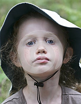 A Portrait of a Little Girl in a White Hat