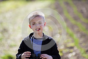 Portrait of little handsome serious cute blond boy with funny un