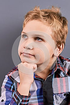 Portrait of little pensive boy.