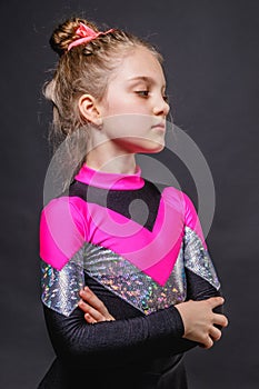 Portrait of little pensive cheerleader girl