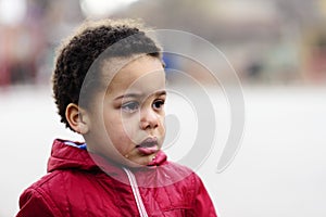 Portrait of a little upset boy crying.