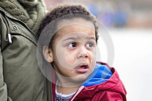 Portrait of a little upset toddler boy crying