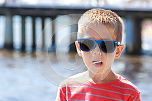 Portrait of little young boy kid at sea. Summer.