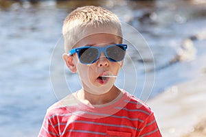 Portrait of little young boy kid at sea. Summer.