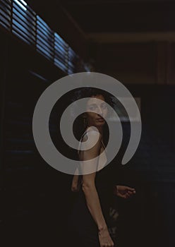 Portrait of a lone woman at a bar