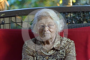 Portrait lonely sad senior elderly old woman in evening wear