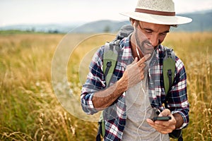 Portrait of a loner male traveller exploring the nature photo