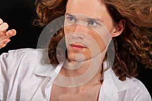 Portrait of long-haired handsome man