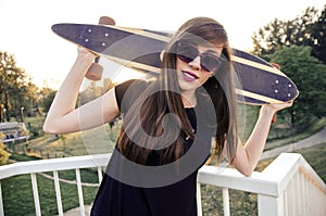 Portrait of longboarder girl