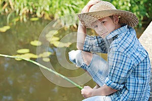 Portrait of looking at camera angling boy on