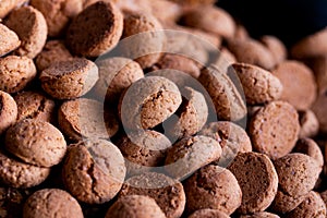 A portrait of a lot of tasty traditional dutch snacks called pepernoten or pepernuts. The gingerbread treat is a tradition during