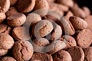 A portrait of a lot of traditional dutch snacks called pepernoten or pepernuts. The gingerbread treat is a tradition during the