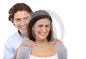 Portrait, love and couple hug in studio, smile and relax while bonding on white background. Interracial, marriage and