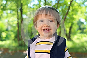 Portrait of lovely 2 years toddler boy in summer