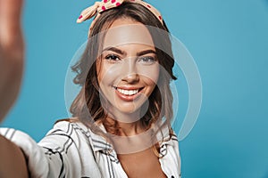 Portrait of lovely brunette woman 20s wearing headband smiling a