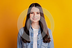 Portrait of lovely cheerful positive girl on yellow background