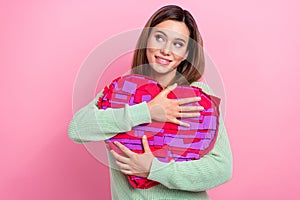 Portrait of lovely girlfriend nice person hugs her surprise pinata heart shape looking empty space dreams isolated on